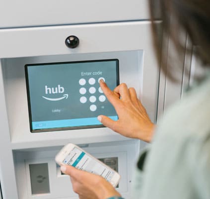 a person withdrawing money from an atm machine