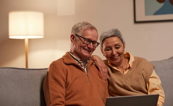 Two happy people inside an apartment 