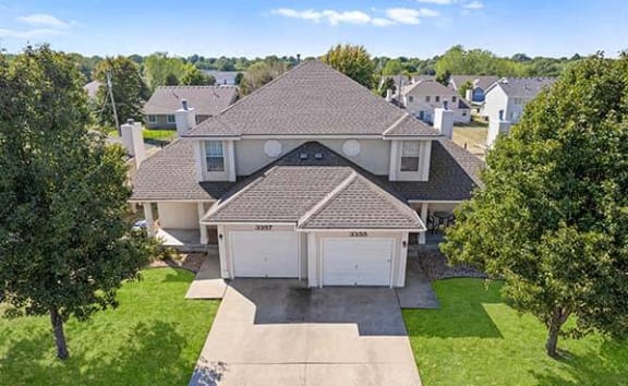 an aerial view of a house with a garage