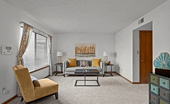 a living room with a couch and a table
