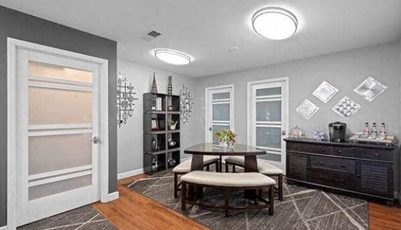 a living room with a table and a door