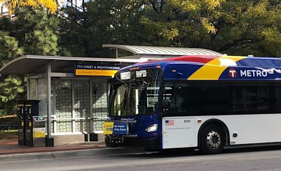 a bus is stopped at a bus stop