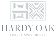 A black and white image of a logo for Hardy Oak Luxury Apartments.