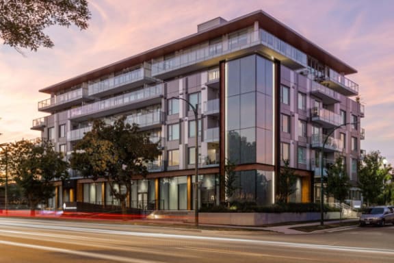 a rendering of a building on a city street