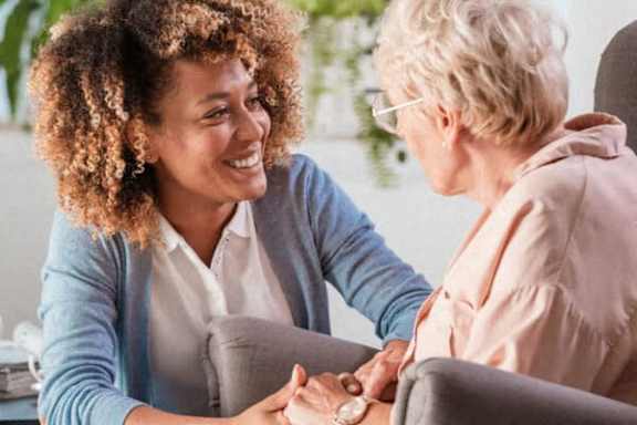 a woman talking to an older woman in a conversation