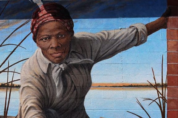 a painting of a man leaning against a brick wall