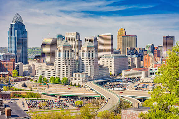 A cityscape with a clear blue sky above.
