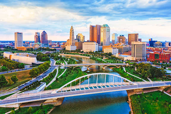 A cityscape with a river running through it.