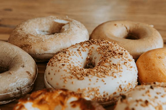 A group of assorted donuts with different toppings.