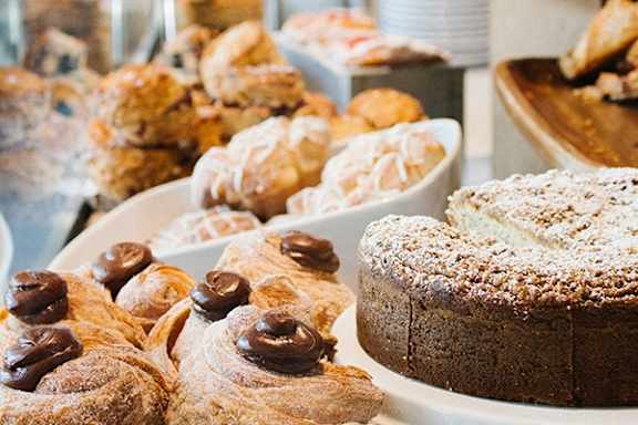 a variety of pastries on display at a bakery