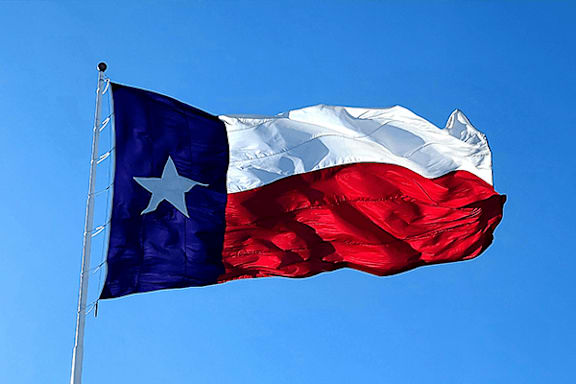 The Texas flag is waving in the wind.