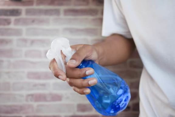 a person holding a blue bag and a white napkin