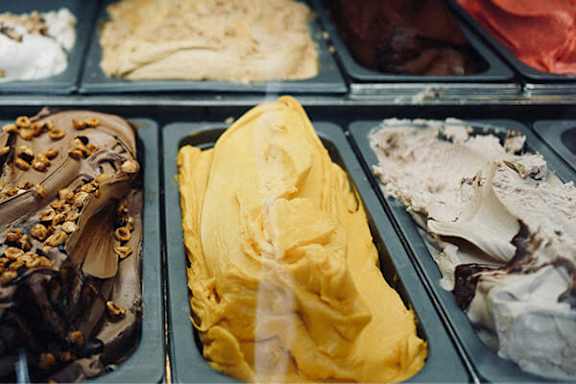 A tray of different flavors of ice cream.