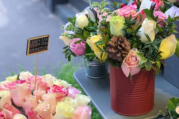 a bouquet of flowers in a vase on a table