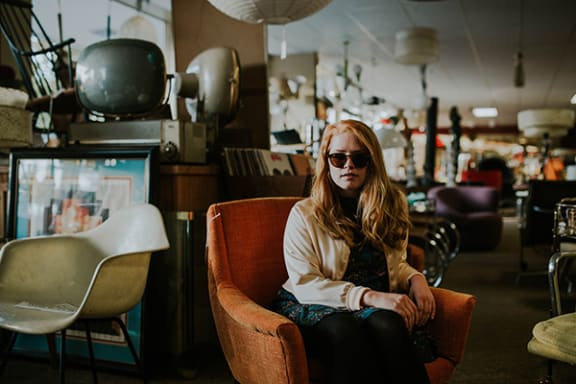 a woman sitting in a chair