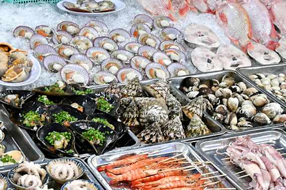 A seafood display with a variety of shellfish and fish.
