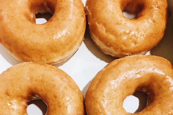 a box of doughnuts sitting on top of a table