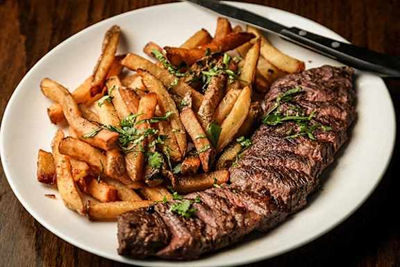 Plate of steak and fries.