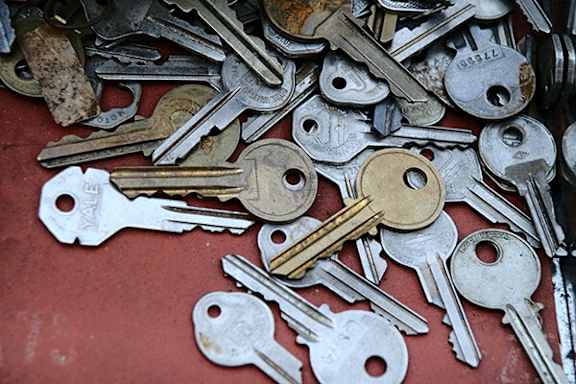 A pile of old, rusty keys.