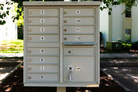 A mailbox with numbers 1 to 12 on it.