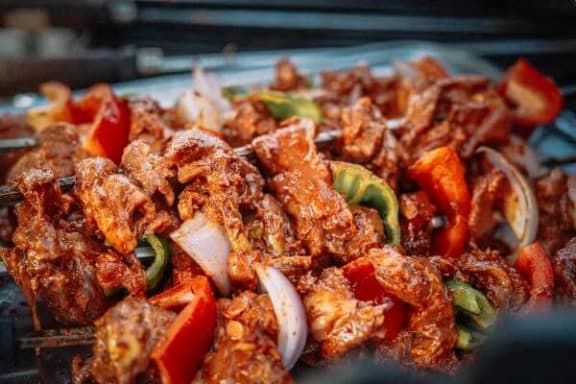 a plate of food with meat and vegetables