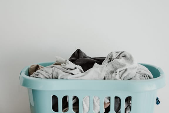 a laundry basket full of clothes
