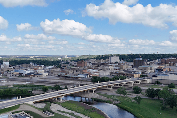 A cityscape with a river running through it.
