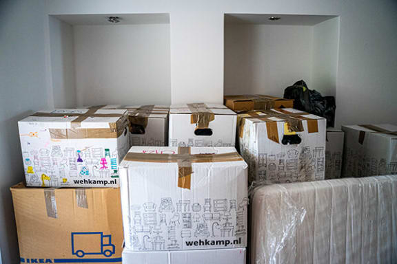 a room filled with cardboard boxes