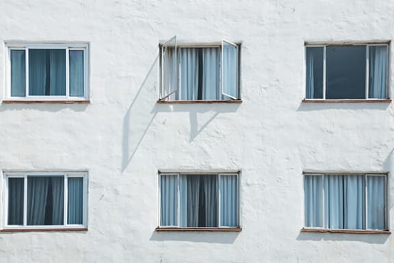 a row of windows on a white building