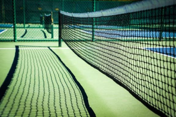 a tennis court with a tennis net