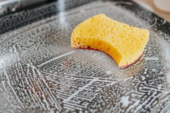 a yellow sponge on a plate with a design on it
