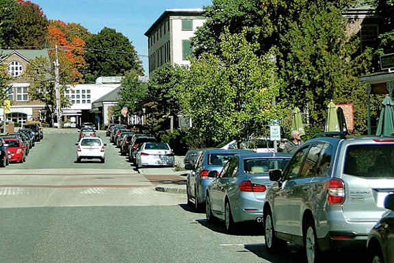 Cars parked on the side of a street.