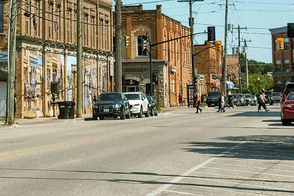 A city street with cars and buildings.