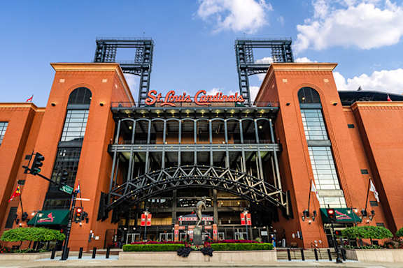 A large red building with a large entrance and a sign that says St. Louis Cardinals.