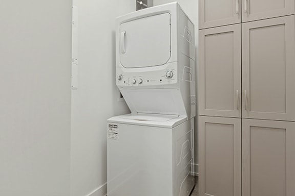 A white oven and microwave in a kitchen.