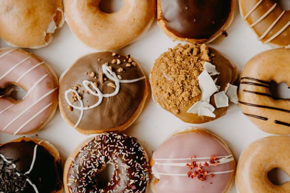 a bunch of donuts that are sitting on a table