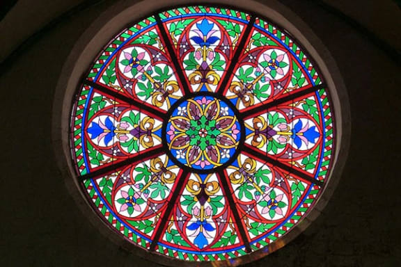 a large stained glass window in a building