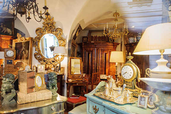 A room full of vintage items including a clock.
