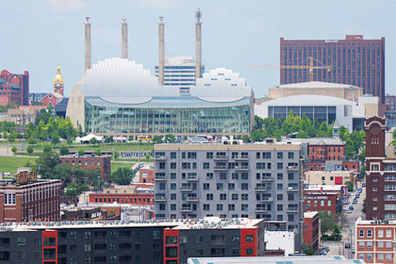 A cityscape with a large white dome building in the center.