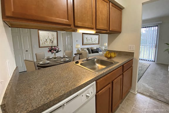 Kitchen with Open Bar Counter at Stone Ridge Apartments, Wixom, MI