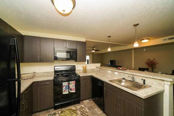 Lots of Counter Space as well as a Breakfast Bar at The Reserve Apartment Homes in Grimes, Iowa