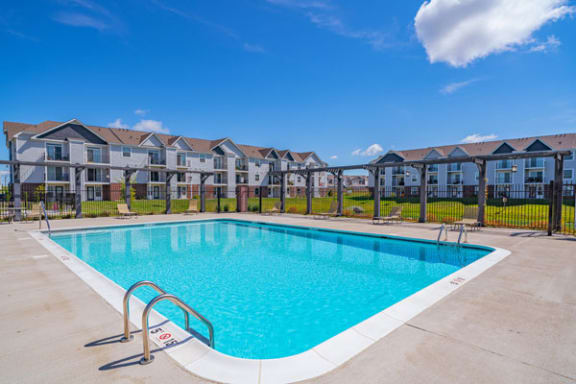 Refreshing Outdoor Pool with Pergola and Sundeck at The Reserve at Destination Pointe apartments, Grimes, IA 50111