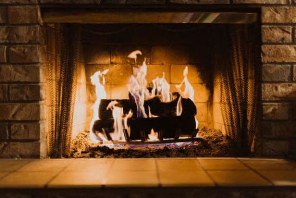 a fireplace with flames in it