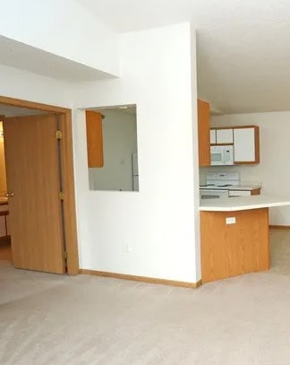 A room with a desk and a cabinet.