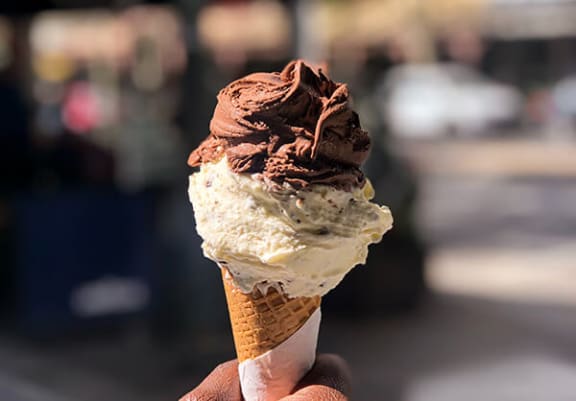 a cone of chocolate and vanilla ice cream