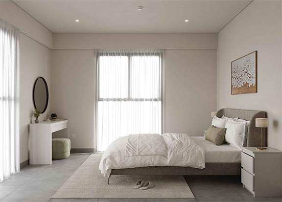 A bedroom with a large bed, a nightstand, and a mirror.