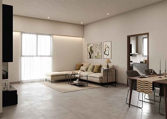 A modern living room with a white sofa and a coffee table.