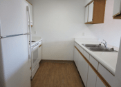 Thumbnail 6 of 14 - Louise Garden Vacant Kitchen