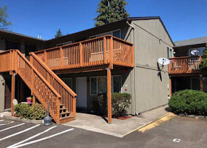 a building with a wooden deck on the side of it