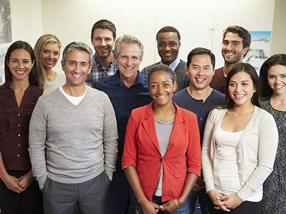 A group of people standing together in a line.